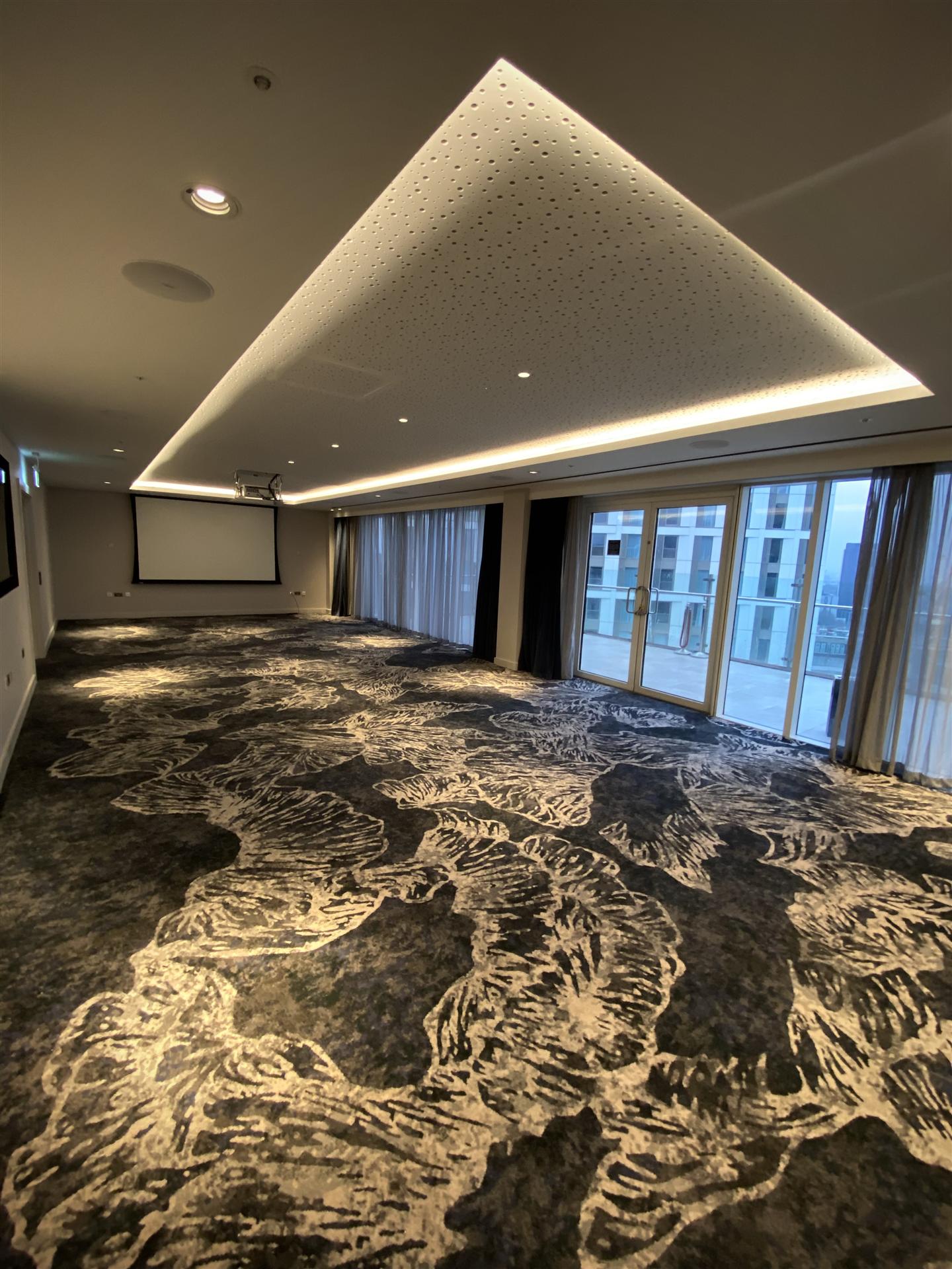 Luxury conference room with projection screen and LED ceiling, London